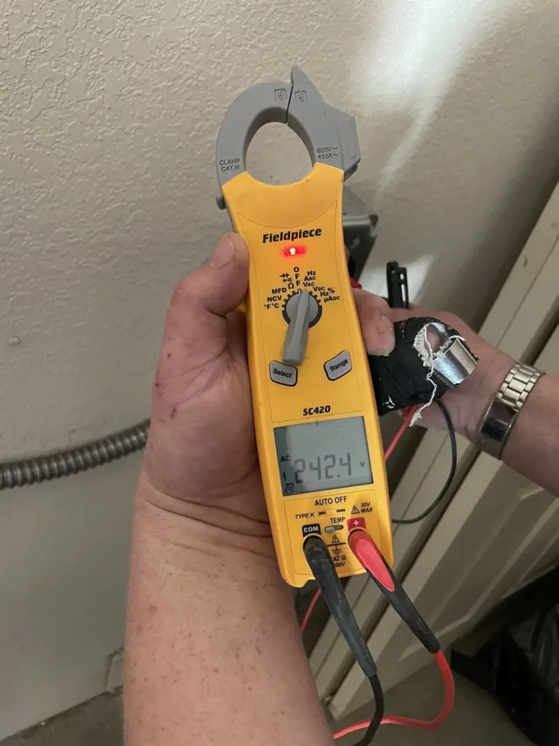 Voltage testing with clamp meter during Whole House Surge Protector in Chatsworth
